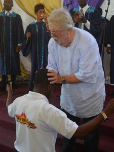 Rev. Mal ministering to an ETHBC student